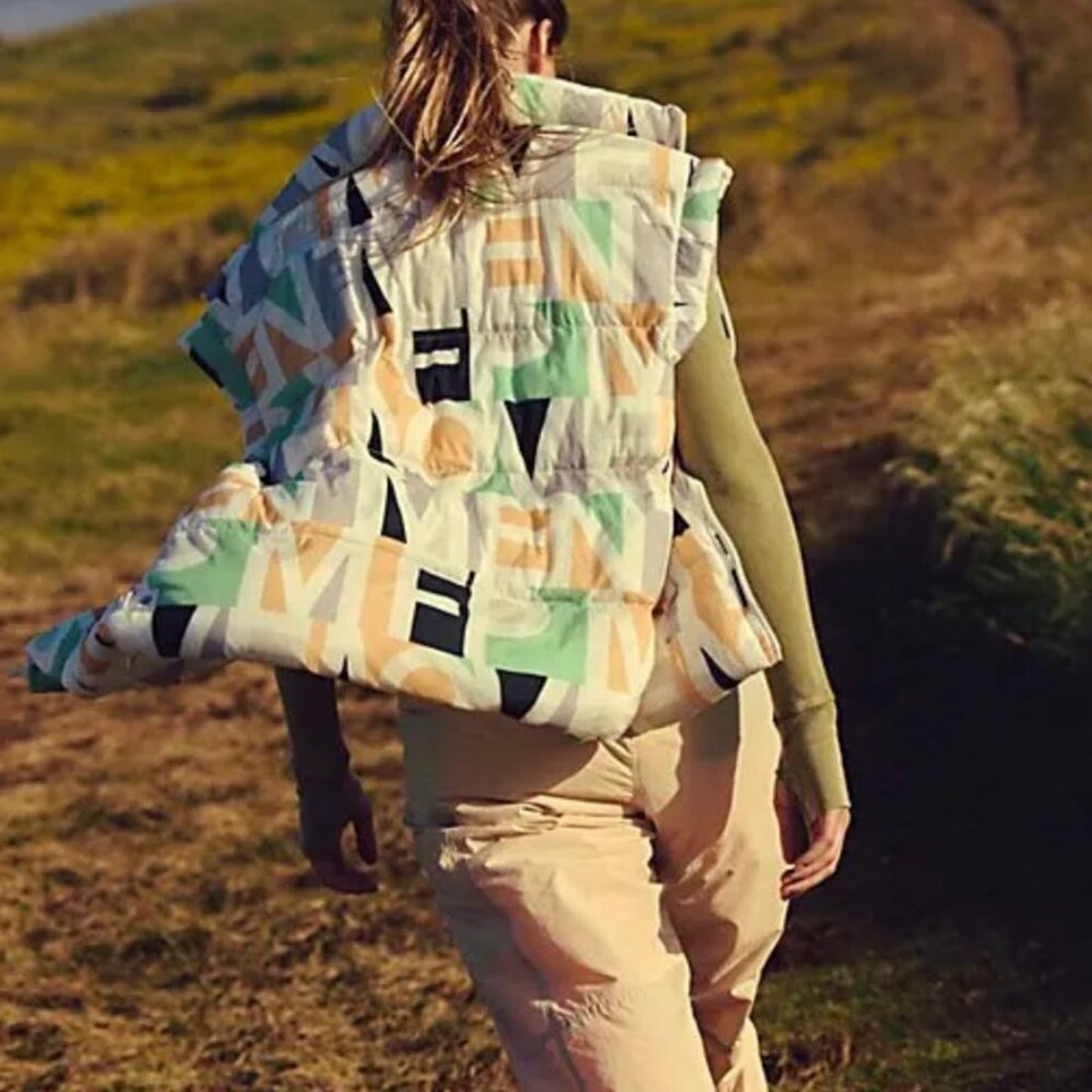 Free People In A Bubble Printed Puffer Vest in Blocked Logo